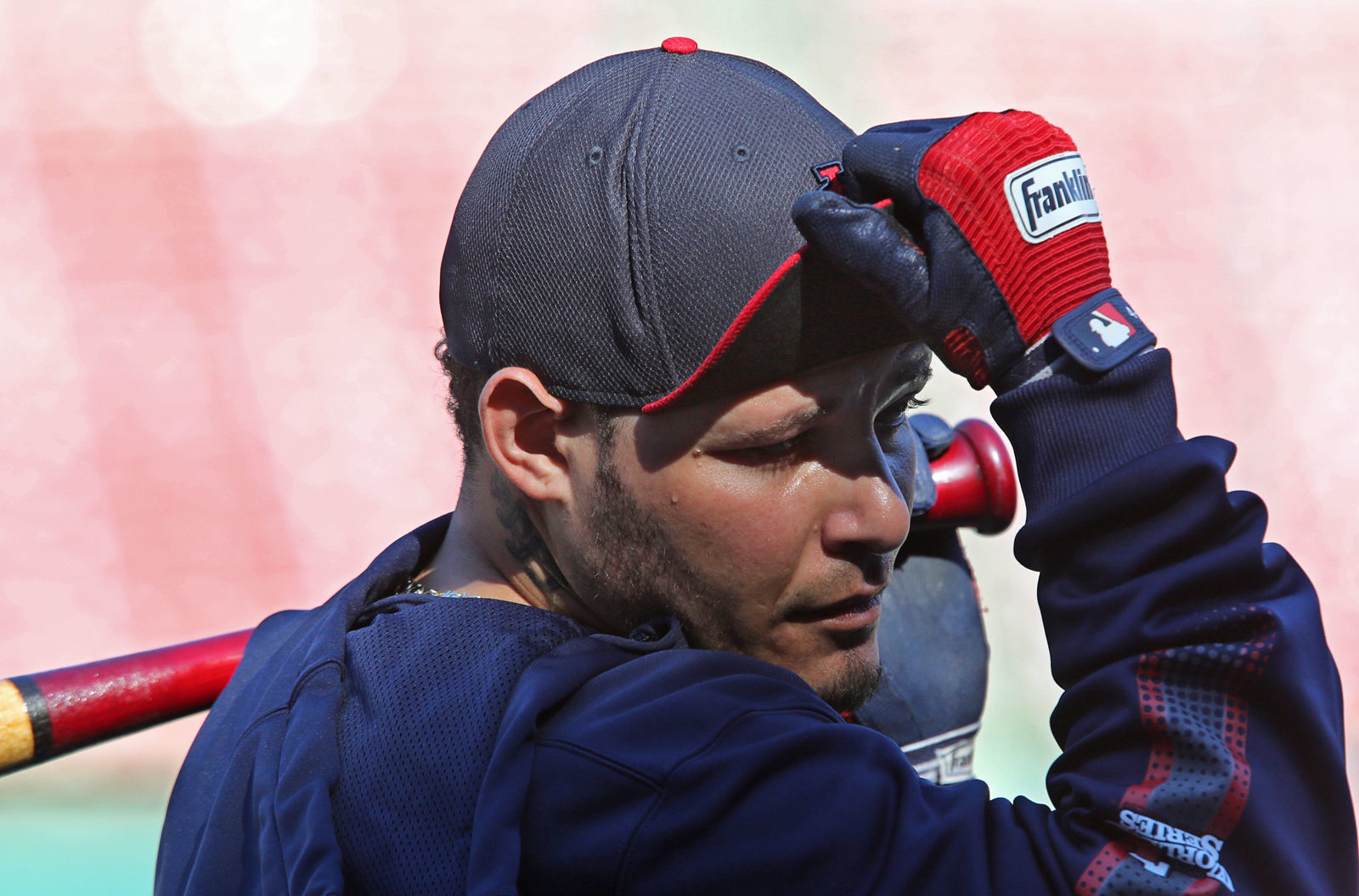 Yadier Molina adjusts his hat during 2013 practice